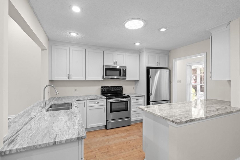 Nestled on a large, shaded 0.48-acre corner lot in the heart of - photo 14