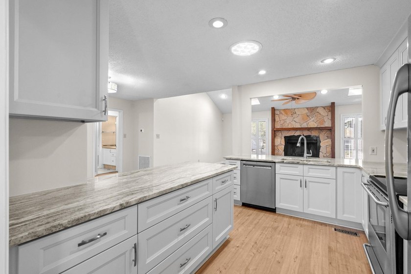 Nestled on a large, shaded 0.48-acre corner lot in the heart of - photo 15