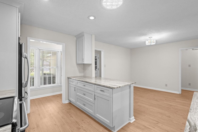 Nestled on a large, shaded 0.48-acre corner lot in the heart of - photo 17