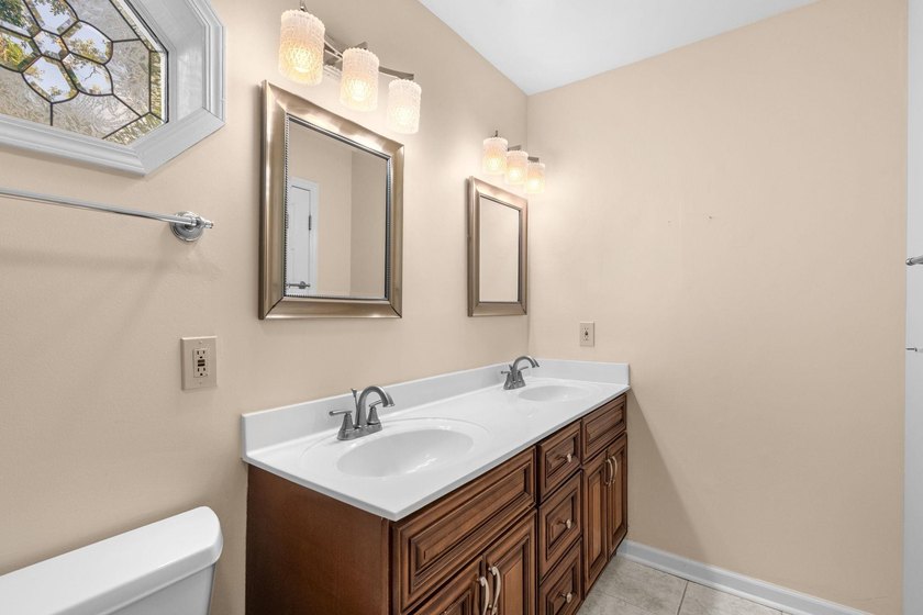 Nestled on a large, shaded 0.48-acre corner lot in the heart of - photo 28