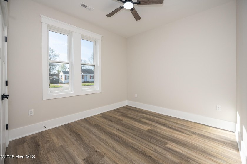 New construction home featuring 3 bedrooms and 2 bathrooms with - photo 7