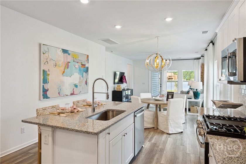 This cozy single-story Palmetto home design features an open - photo 2