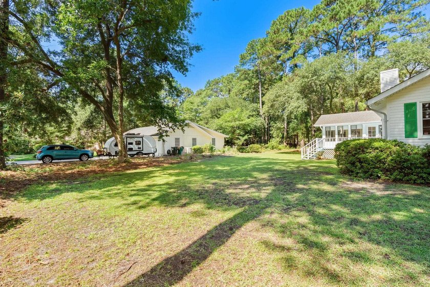 Nestled on a large, shaded 0.48-acre corner lot in the heart of - photo 44
