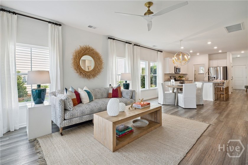 This cozy single-story Palmetto home design features an open - photo 9