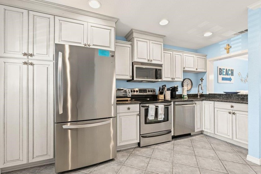 Experience the ultimate beachfront lifestyle in this stunning - photo 3