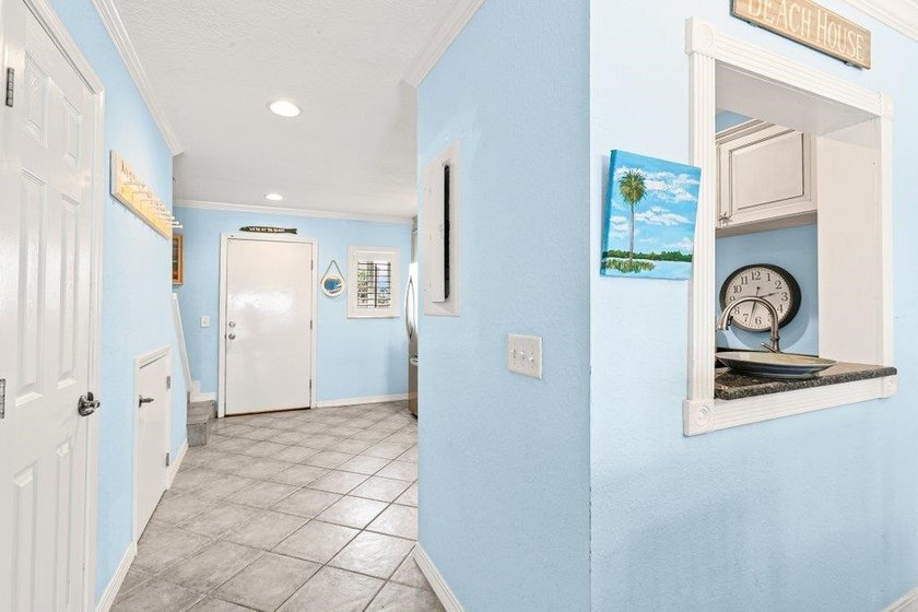Experience the ultimate beachfront lifestyle in this stunning - photo 7