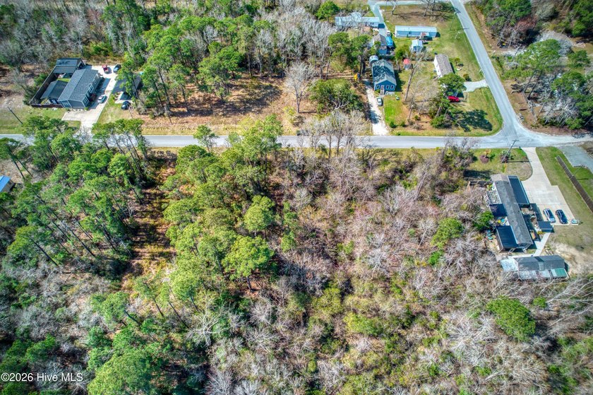 This nearly half-acre wooded lot in Snug Harbor offers the - photo 2