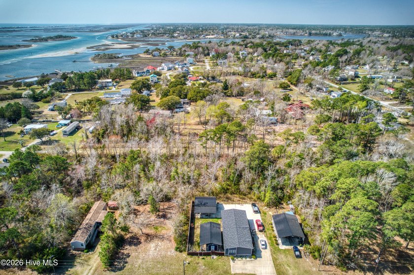 This nearly half-acre wooded lot in Snug Harbor offers the - photo 8