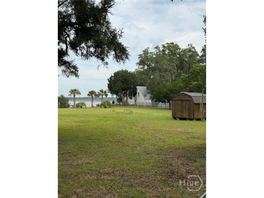SAPELO RIVER .87 ACRE DEEP WATER LOT WITH DOCK AND TWO SHEDS - photo 2