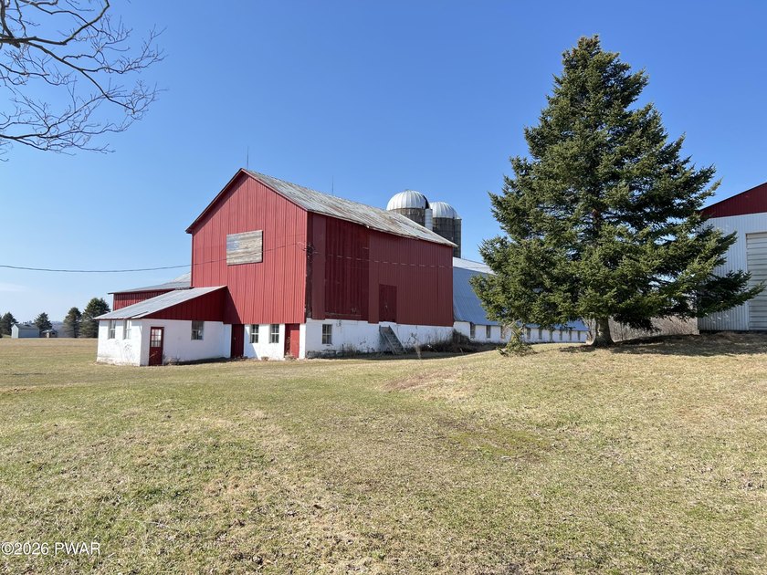 This property features a well-maintained barn roughly 12,000 sq - photo 5