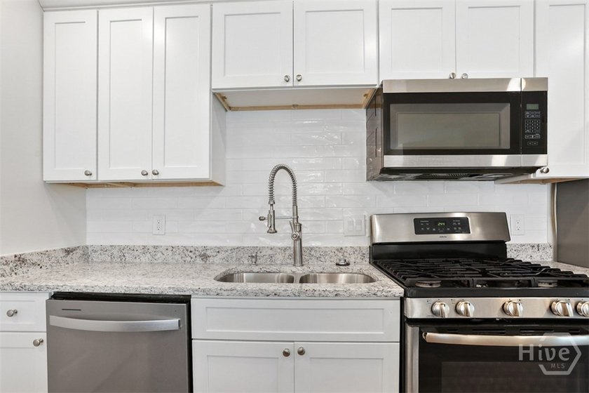 Welcome to this beautifully renovated home, where quality - photo 9