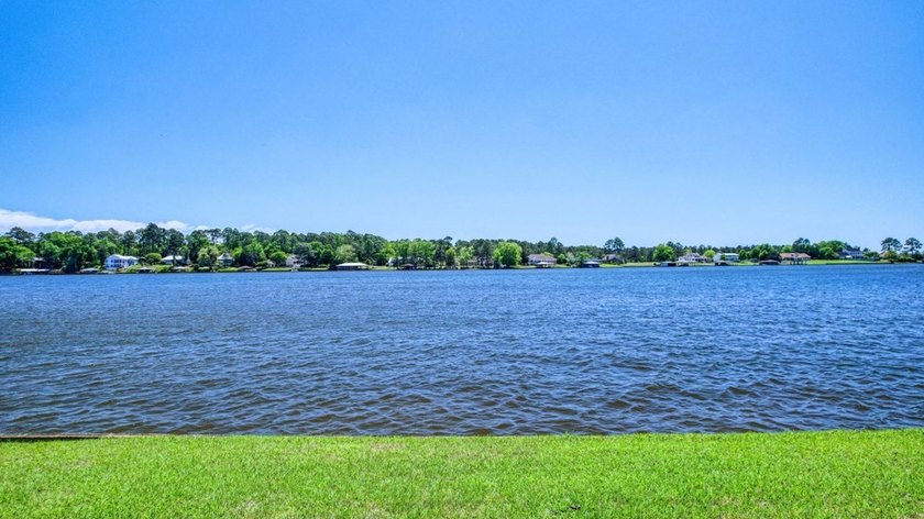 This Lake Home is truly a rare gem! Nestled along 165 Feet of - photo 3