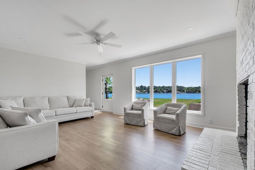 This Lake Home is truly a rare gem! Nestled along 165 Feet of - photo 5