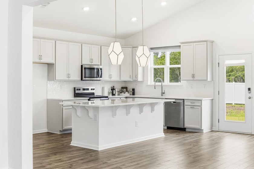 Welcome to 8663 Farrier Drive in the highly sought-after - photo 12