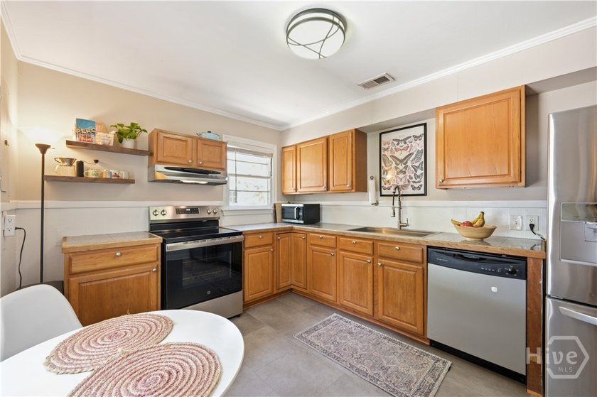 Full of historic charm, this 1950-built bungalow sits in - photo 8