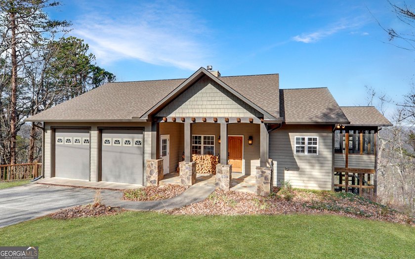 Step into this 3-bedroom, 3.5-bath mountain retreat in scenic - photo 2