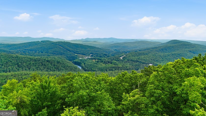 Step into this 3-bedroom, 3.5-bath mountain retreat in scenic - photo 3
