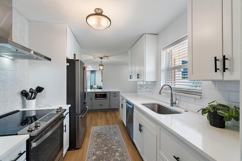 Positioned on an oversized corner lot in Lake Clarke Shores - photo 3