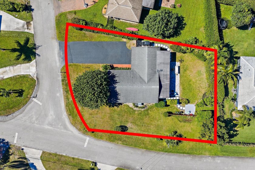 Positioned on an oversized corner lot in Lake Clarke Shores - photo 6