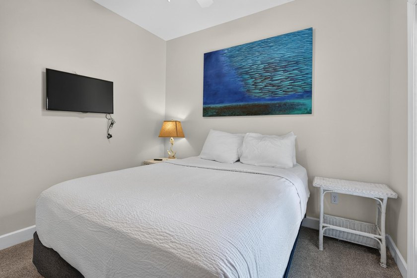 Discover coastal living just steps from the sugar-white sands of - photo 24