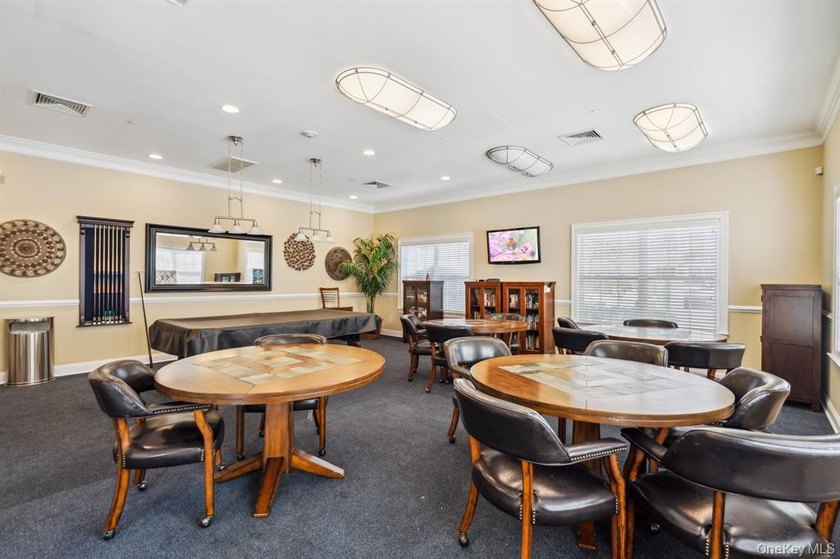 Welcome to this highly sought-after first-floor end unit located - photo 28