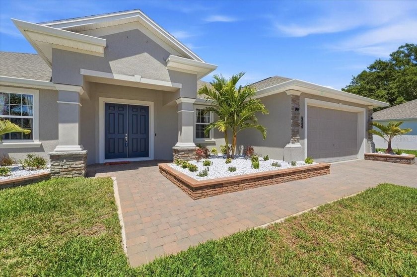 Discover elevated living behind the gates of Lake Ariana Estates - photo 2
