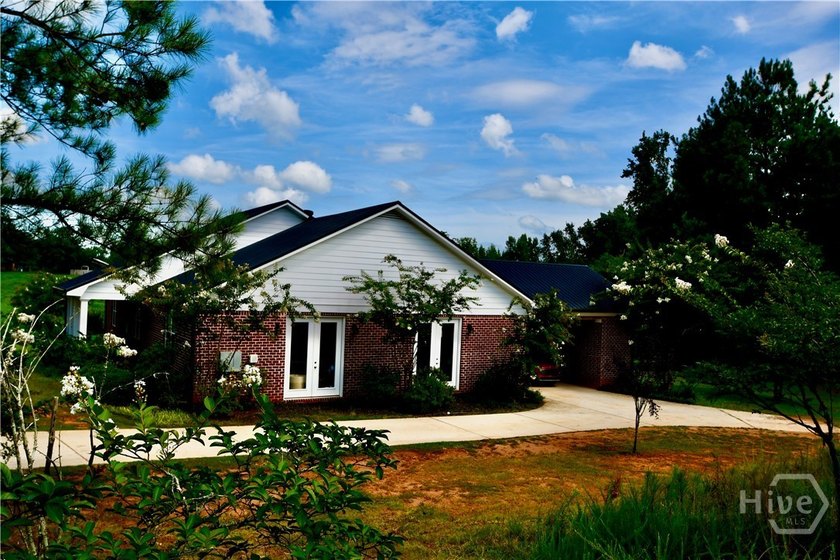 Discover this custom-built brick ranch situated on over an acre - photo 3