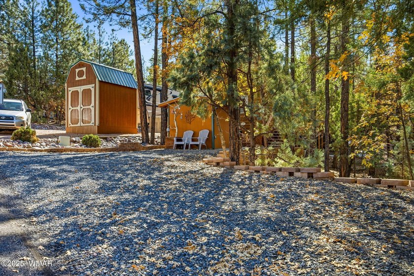 Nestled on a premium, private lot surrounded by towering pines - photo 9