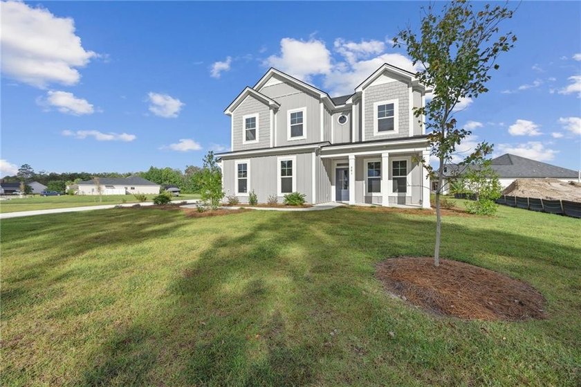 WELCOME HOME TO THE RICHMOND PLAN BY LANDMARK 24 HOMES! STEP - photo 3