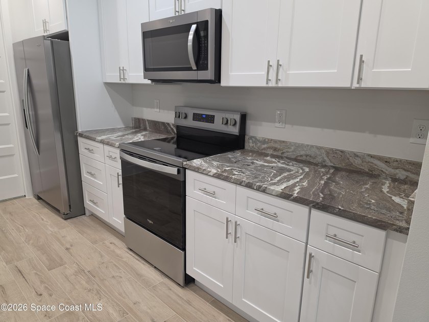Completed and ready for immediate move-in! This truly - photo 13