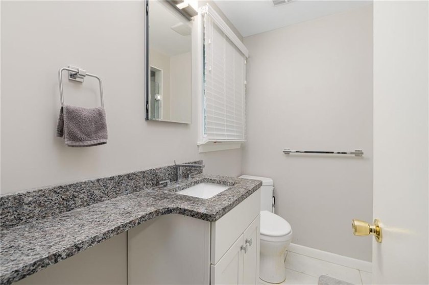 THIS OVERSIZED RAISED RANCH SITS IN A QUIET NEIGHBORHOOD IN - photo 26