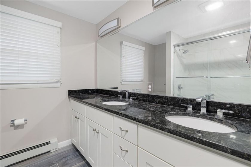 THIS OVERSIZED RAISED RANCH SITS IN A QUIET NEIGHBORHOOD IN - photo 29
