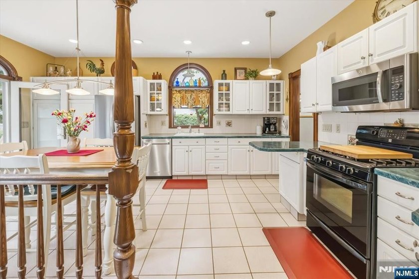 This home is gracefully positioned on a beautifully landscaped - photo 17