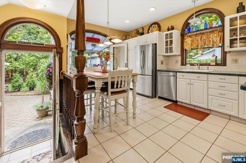 This home is gracefully positioned on a beautifully landscaped - photo 19