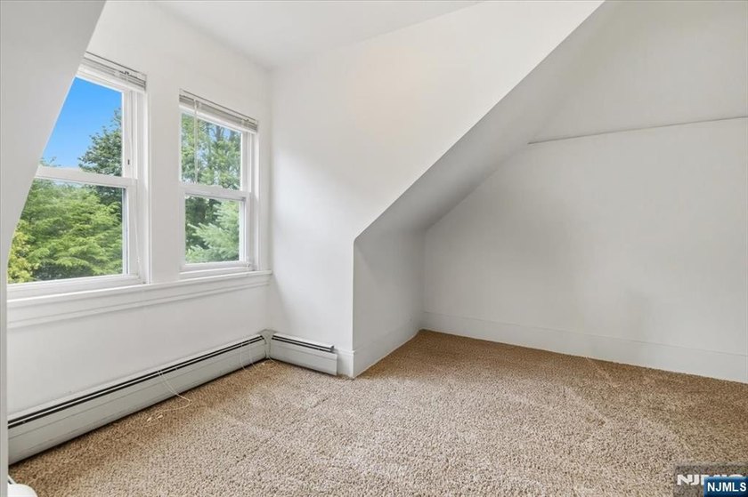 This home is gracefully positioned on a beautifully landscaped - photo 31