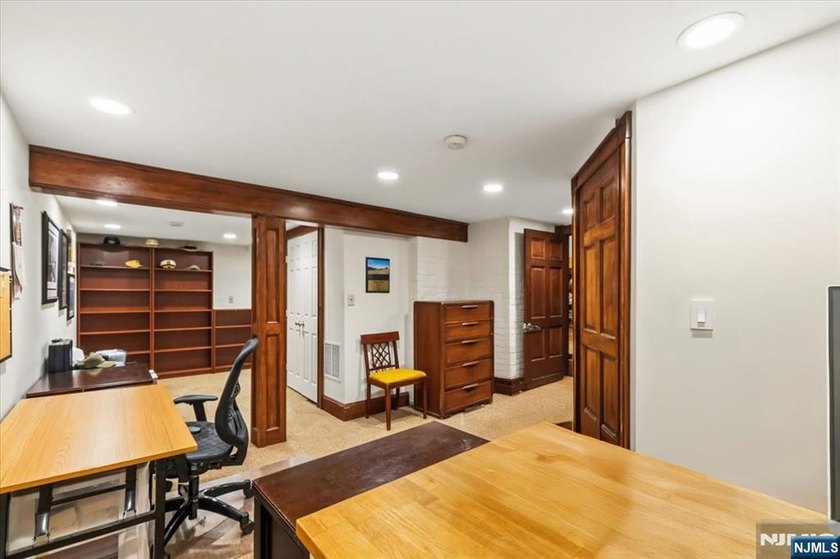 This home is gracefully positioned on a beautifully landscaped - photo 35
