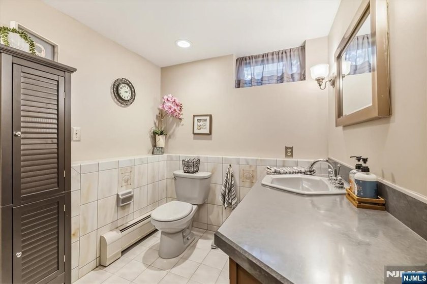 This home is gracefully positioned on a beautifully landscaped - photo 37