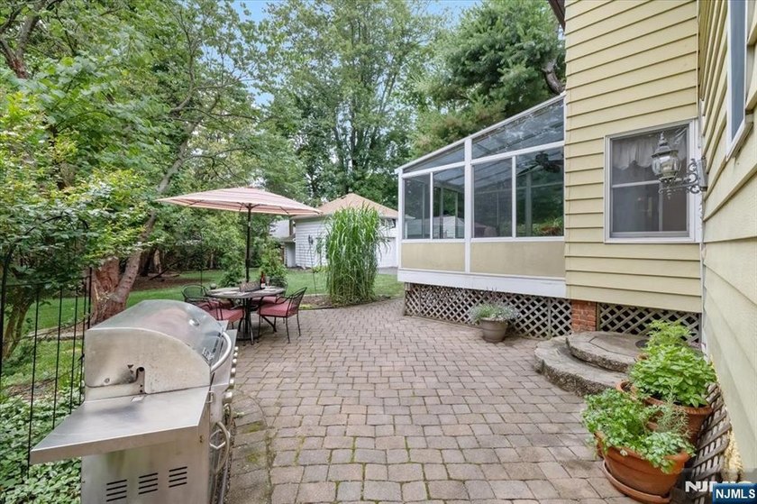 This home is gracefully positioned on a beautifully landscaped - photo 40