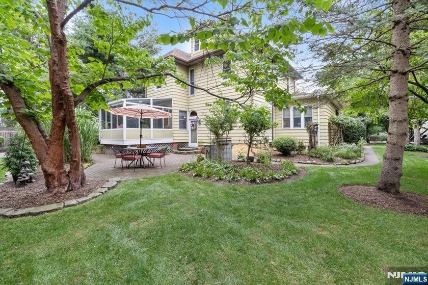 This home is gracefully positioned on a beautifully landscaped - photo 42