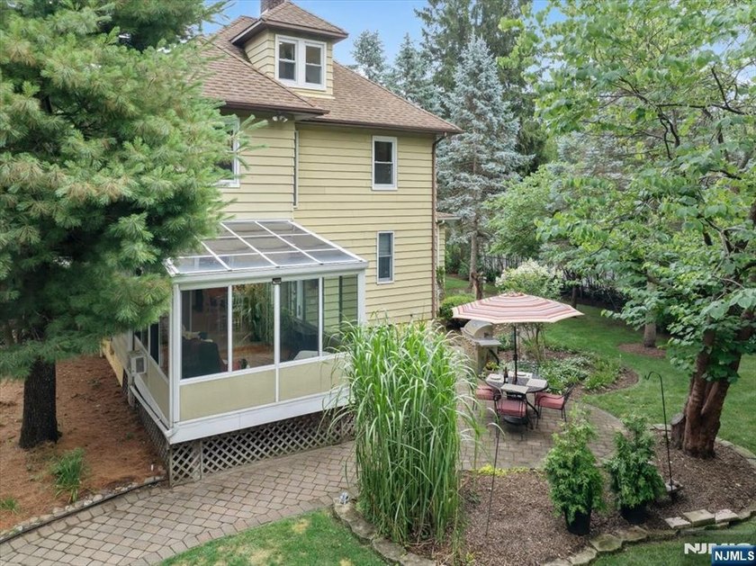 This home is gracefully positioned on a beautifully landscaped - photo 45