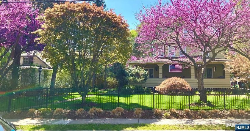 This home is gracefully positioned on a beautifully landscaped - photo 48