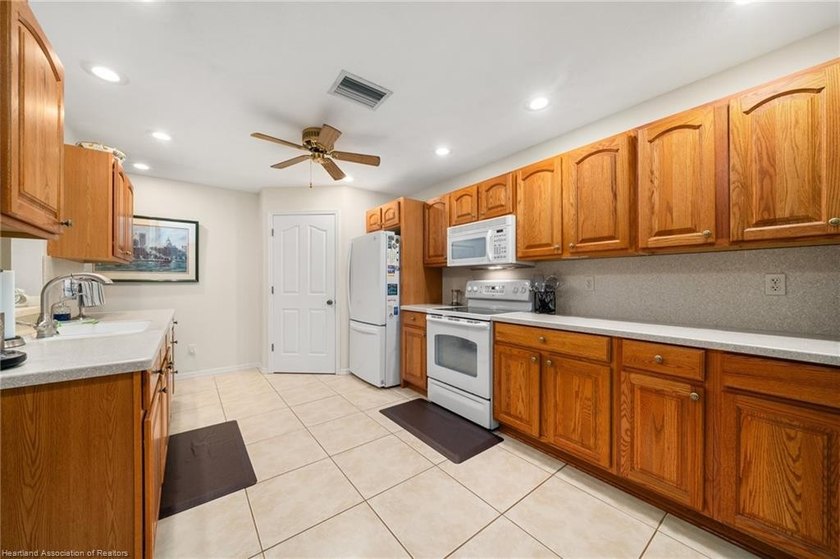 Immaculate Waterfront Living with Direct Lake Access! Nestled on - photo 11