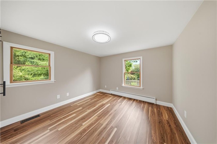 Situated on a one-acre lot along a private road, this - photo 18