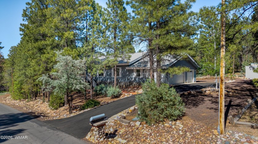 Nestled among the tall pines and bordering National Forest! This - photo 3