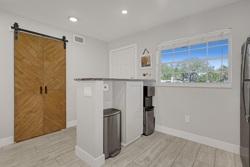 Welcome to this beautifully updated, light-filled corner unit - photo 5