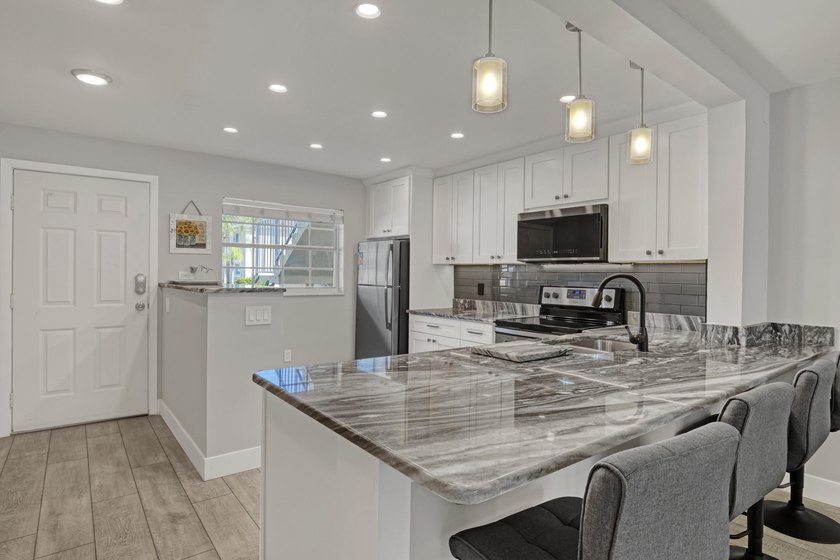 Welcome to this beautifully updated, light-filled corner unit - photo 8