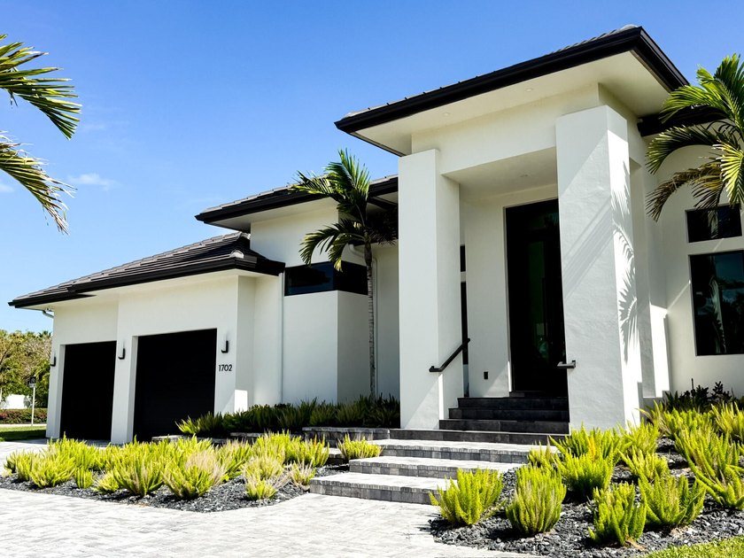 Welcome to 1702 Ludlow Road, a custom home situated on an - photo 4