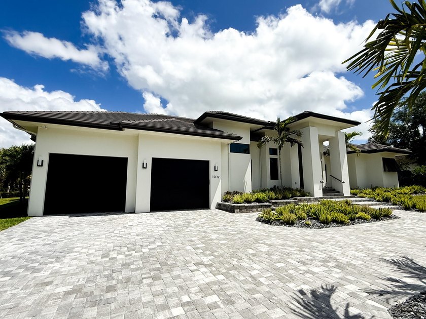 Welcome to 1702 Ludlow Road, a custom home situated on an - photo 9