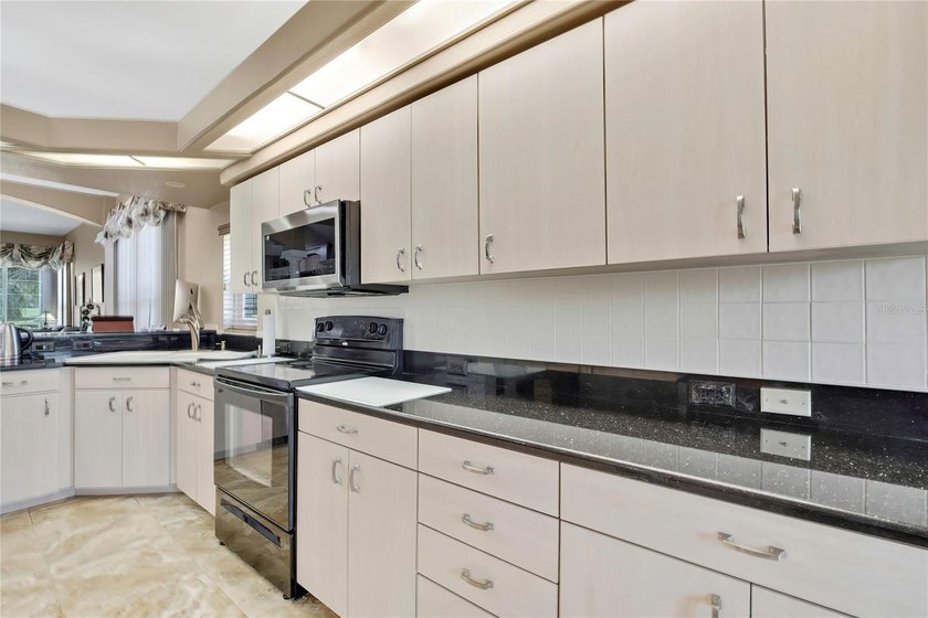 Set within the gated Glen Lakes Golf &amp; Country Club, this 2,238 - photo 14