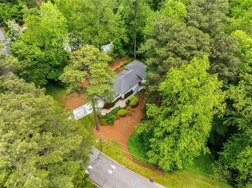 Nestled on a large + acre serene, corner lot in the highly - photo 4